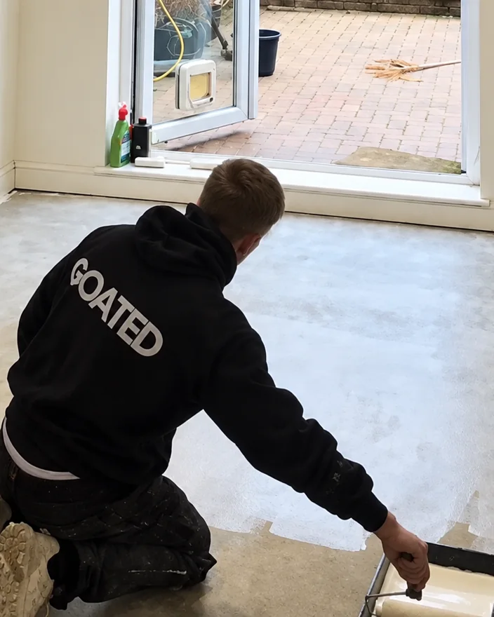 James of Goated Renovations levelling a floor on a job